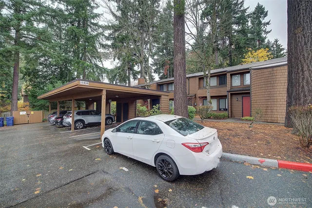 a view of a car parked in front of a house