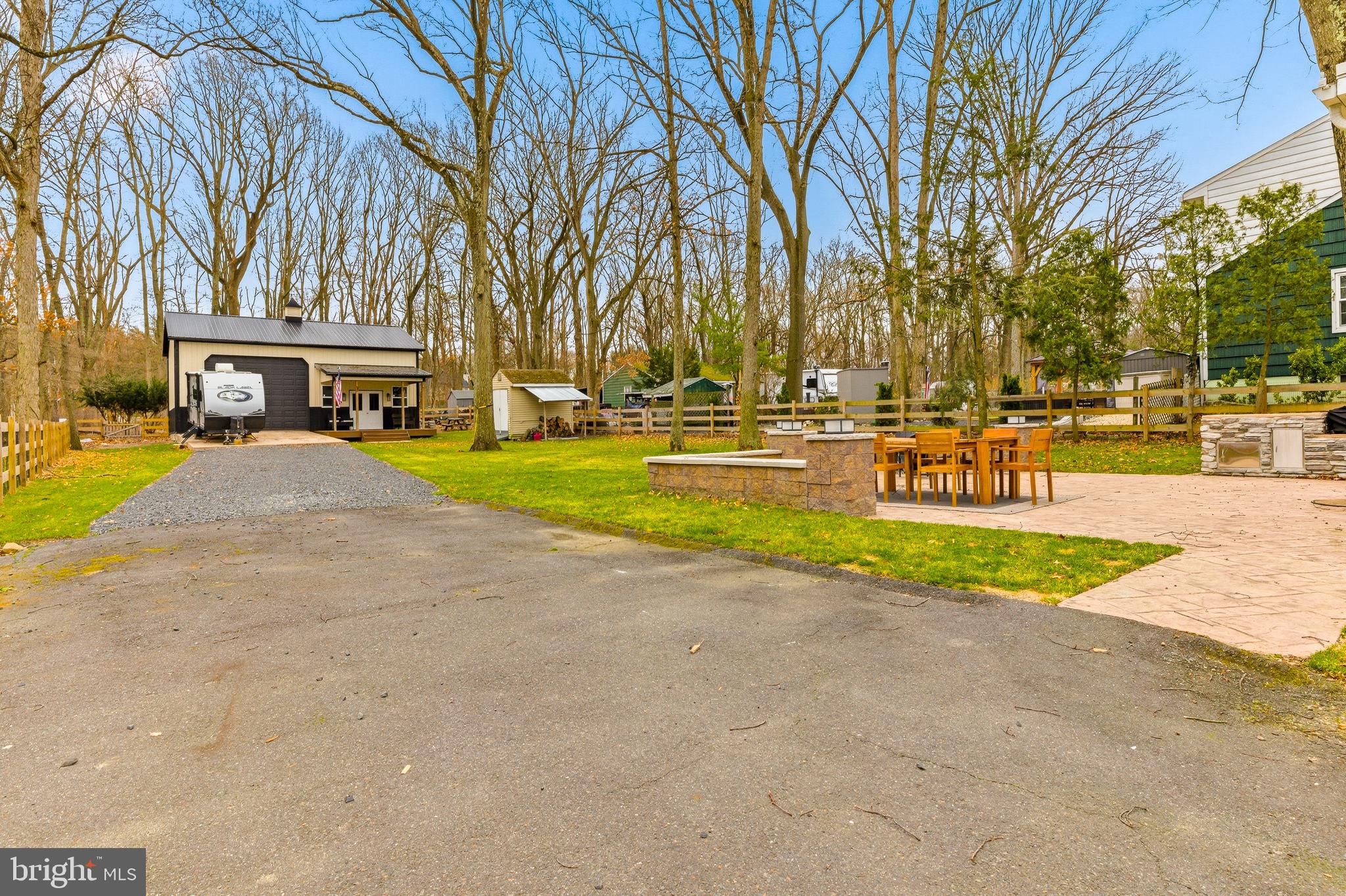 76 Pancoast Boulevard Delran, NJ 08075 - Photo 27 of 36 a view of a swimming pool with a lawn chairs and a fire pit