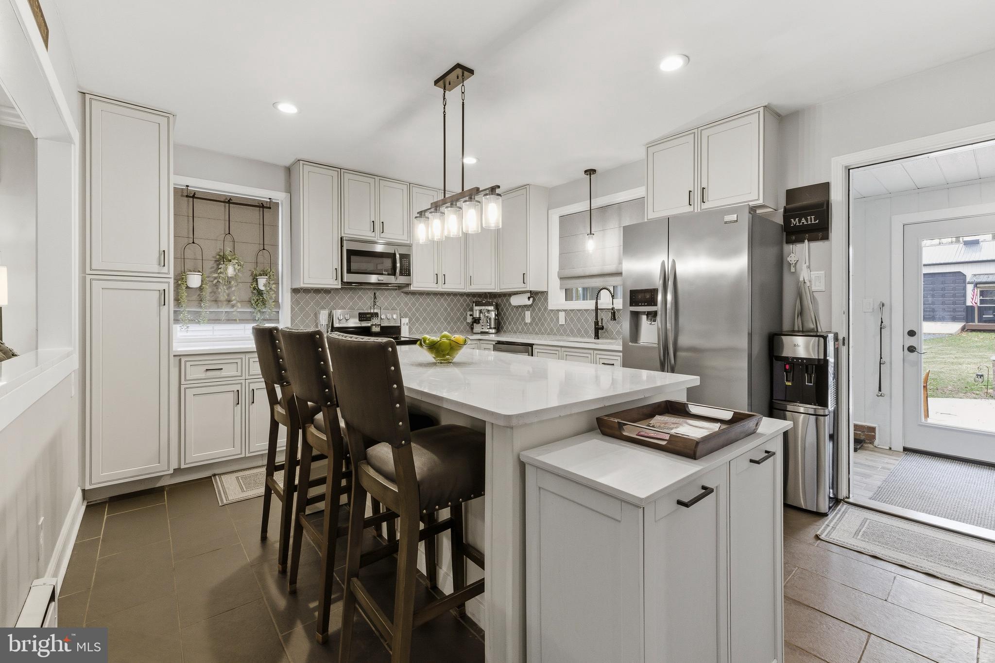 76 Pancoast Boulevard Delran, NJ 08075 - Photo 6 of 36 a kitchen that has a lot of cabinets a sink and appliances in it