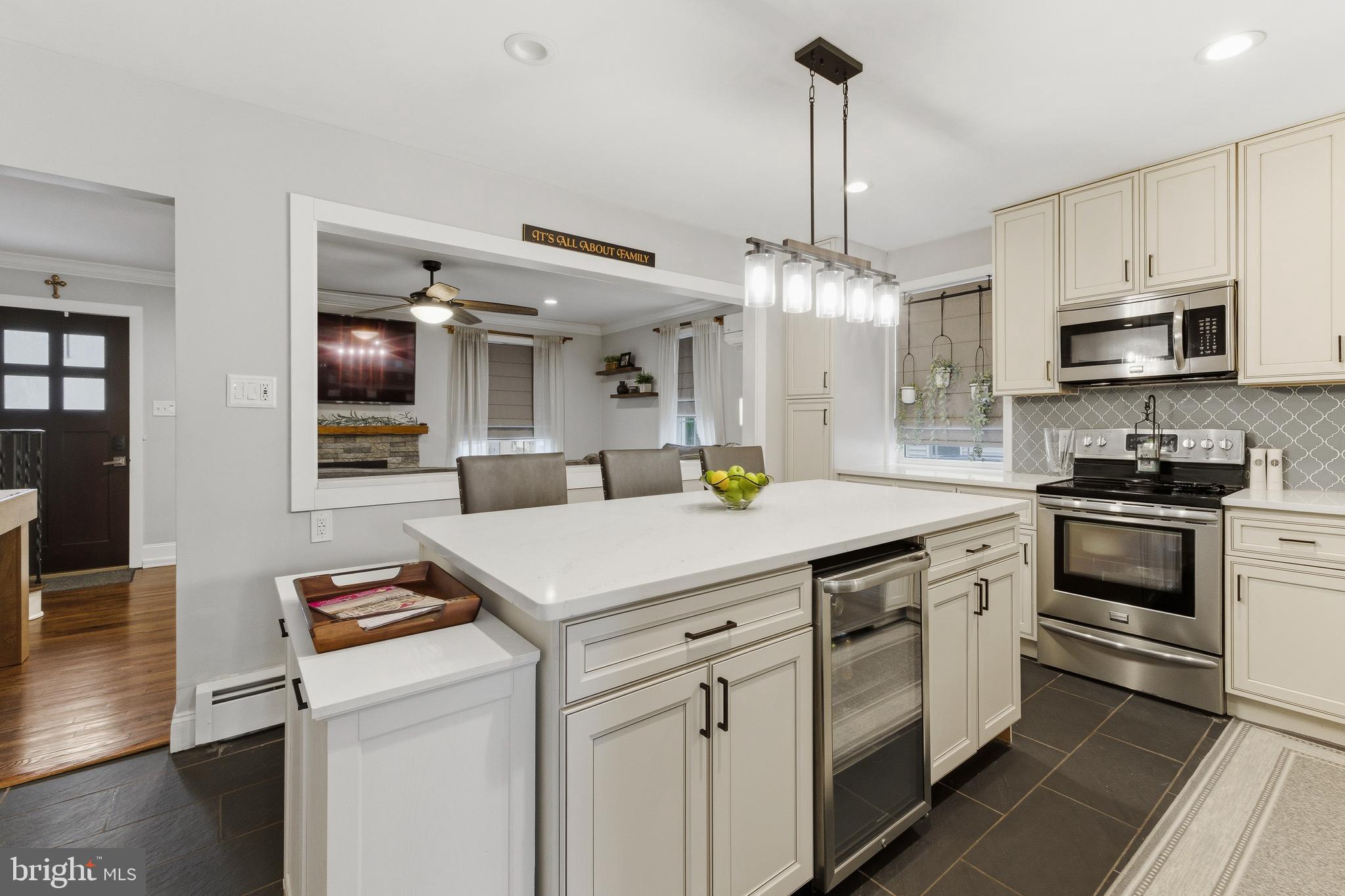 76 Pancoast Boulevard Delran, NJ 08075 - Photo 9 of 36 a kitchen with stainless steel appliances a stove sink and microwave