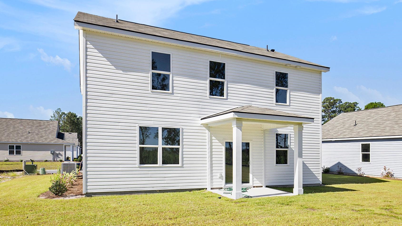 512 Duvall Street Longs, SC 29568 - Photo 2 of 27 Rear view of property with a yard and a patio