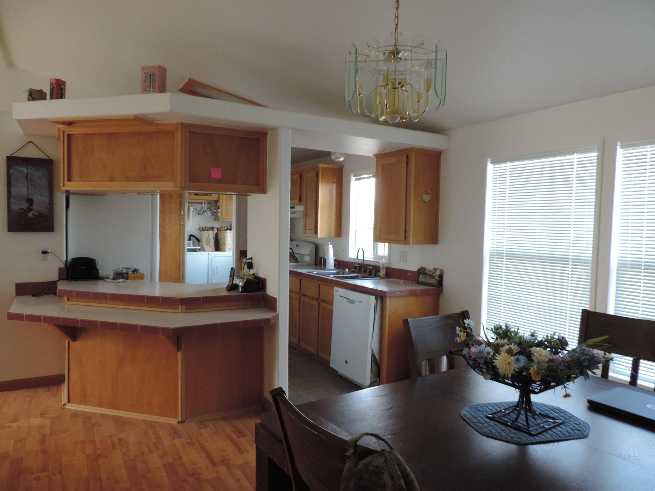 4800 Co Road Adin, CA 96006 - Photo 18 of 27 a kitchen with a table chairs sink and cabinets