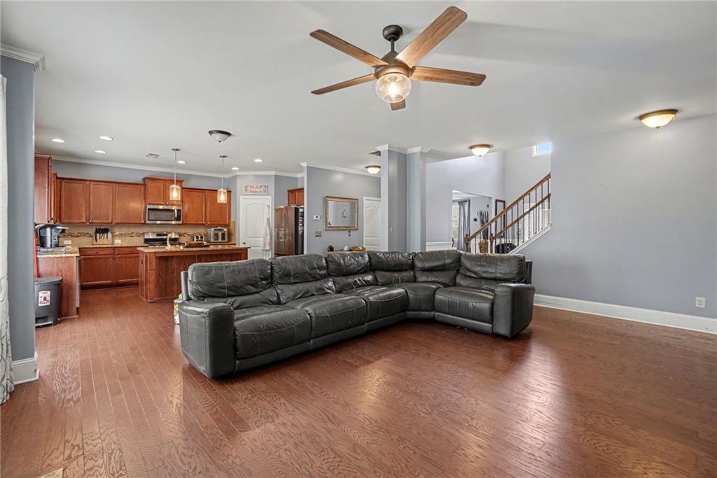 566 Olympic Way Acworth, GA 30102 - Photo 12 of 38 a living room with furniture and kitchen view