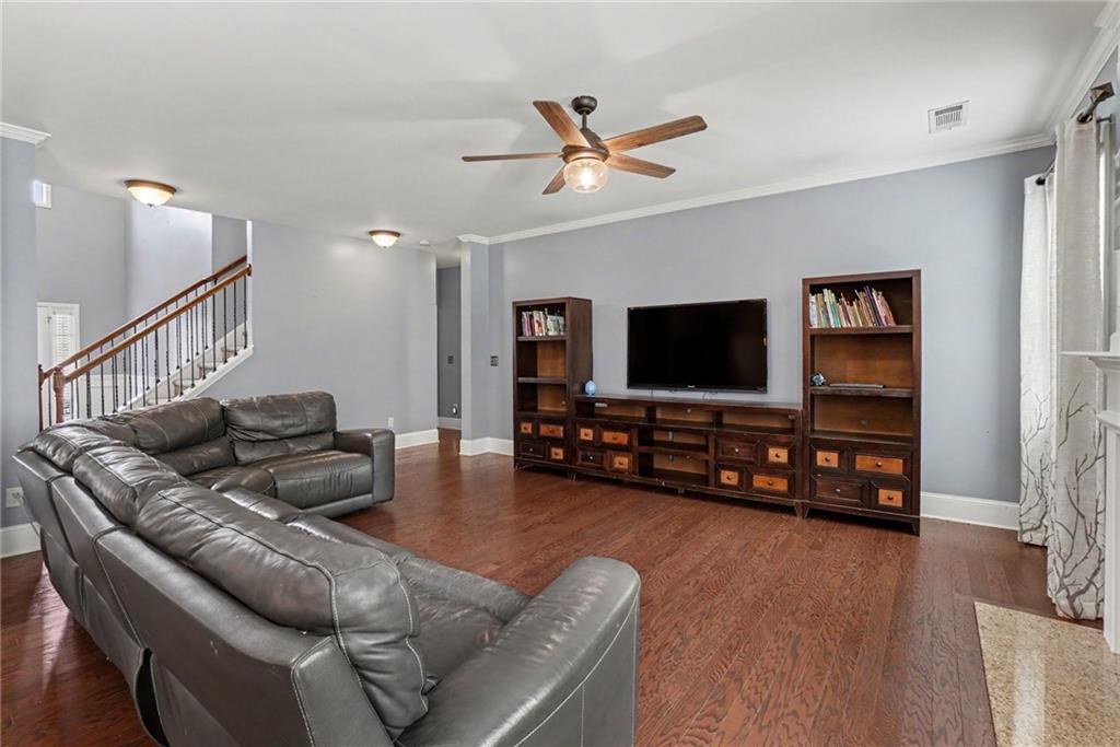 566 Olympic Way Acworth, GA 30102 - Photo 13 of 38 a living room with furniture and a flat screen tv