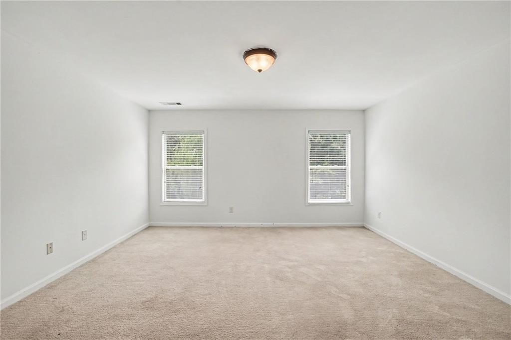 566 Olympic Way Acworth, GA 30102 - Photo 24 of 38 an empty room with windows