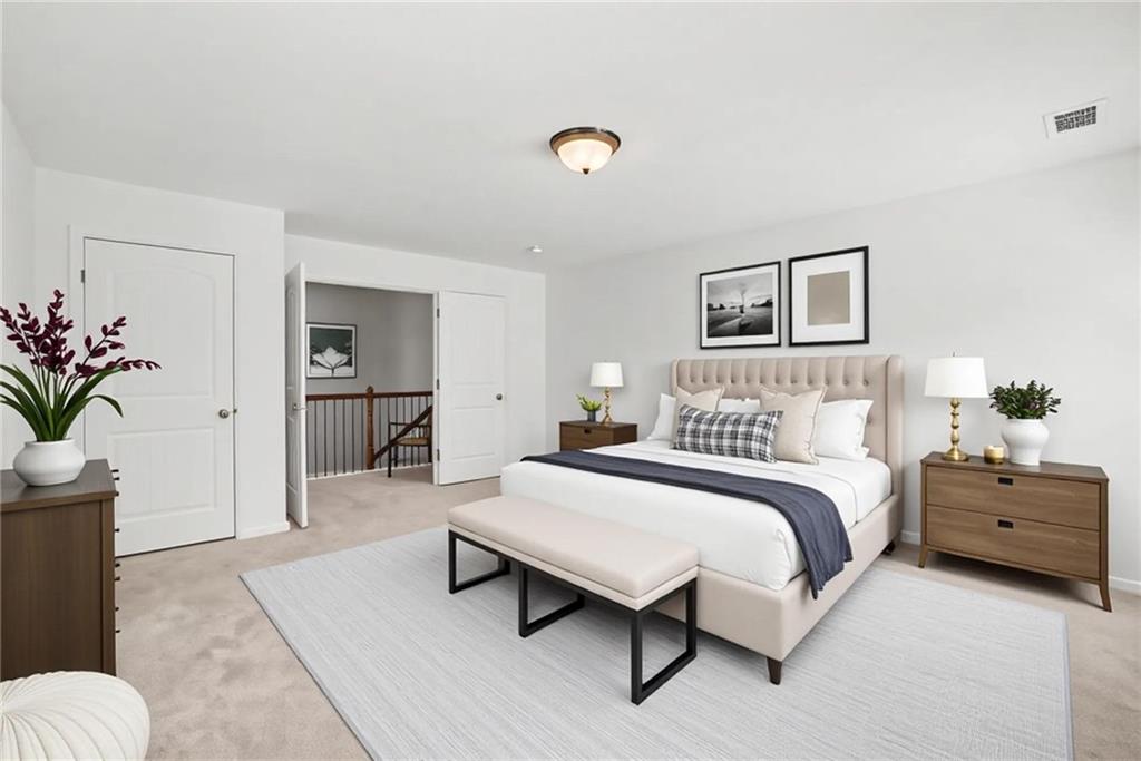 566 Olympic Way Acworth, GA 30102 - Photo 27 of 38 a bedroom with a bed and a couch