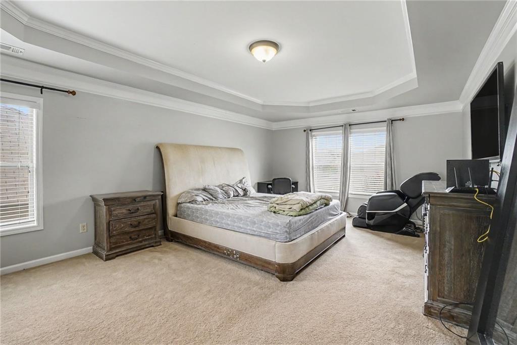 566 Olympic Way Acworth, GA 30102 - Photo 30 of 38 a bedroom with bed and a flat tv screen