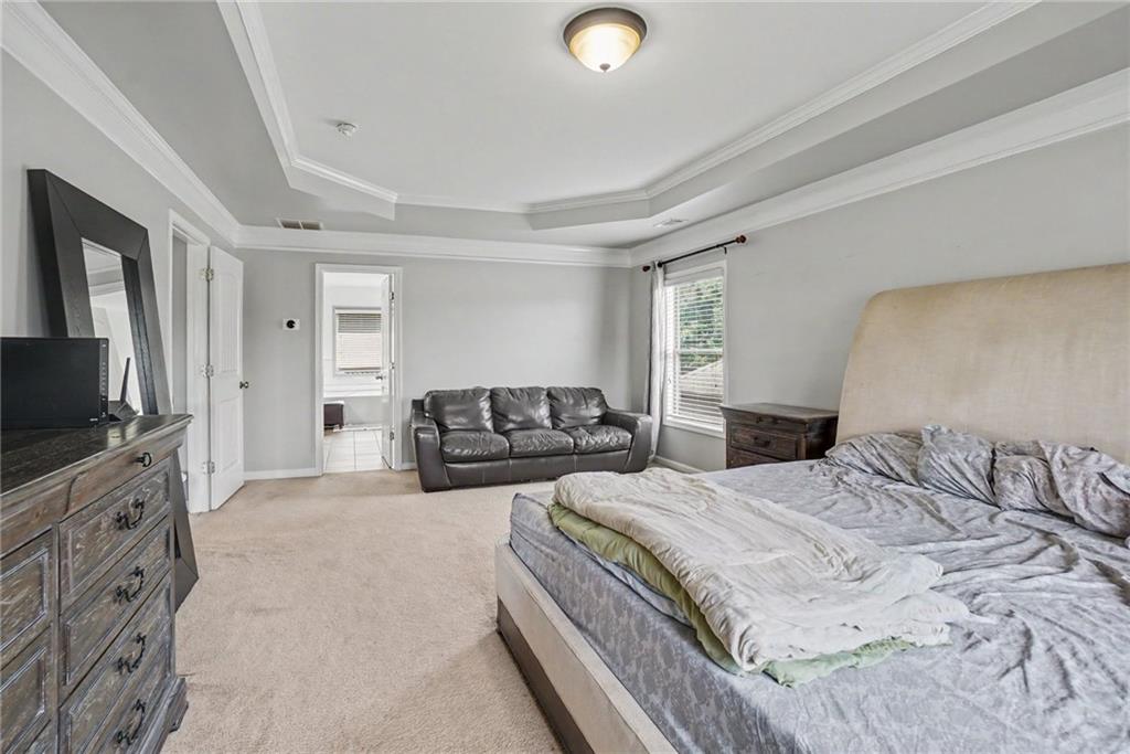 566 Olympic Way Acworth, GA 30102 - Photo 31 of 38 a bedroom with a bed and a flat screen television