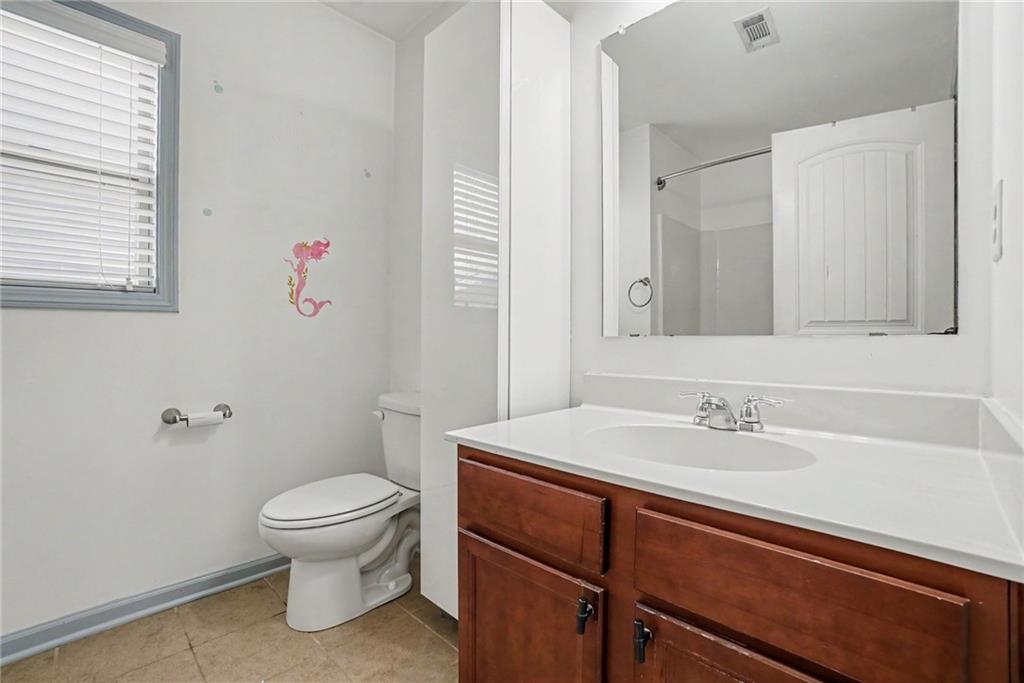 566 Olympic Way Acworth, GA 30102 - Photo 34 of 38 a bathroom with a sink toilet and a mirror