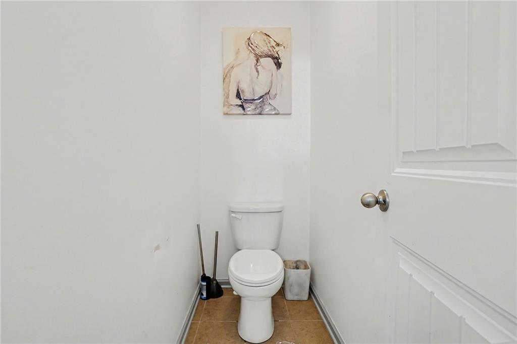 566 Olympic Way Acworth, GA 30102 - Photo 37 of 38 a bathroom with a toilet and a rug