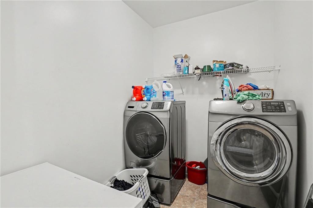 566 Olympic Way Acworth, GA 30102 - Photo 38 of 38 a utility room with dryer and washer