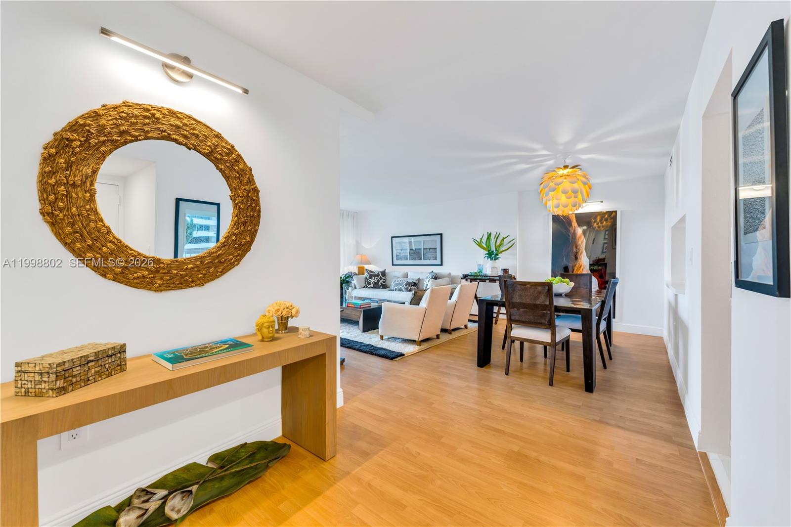199 Ocean Ln Drive, Unit 306 Key Biscayne, FL 33149 - Photo 1 of 15 a living room with furniture and a wooden floor