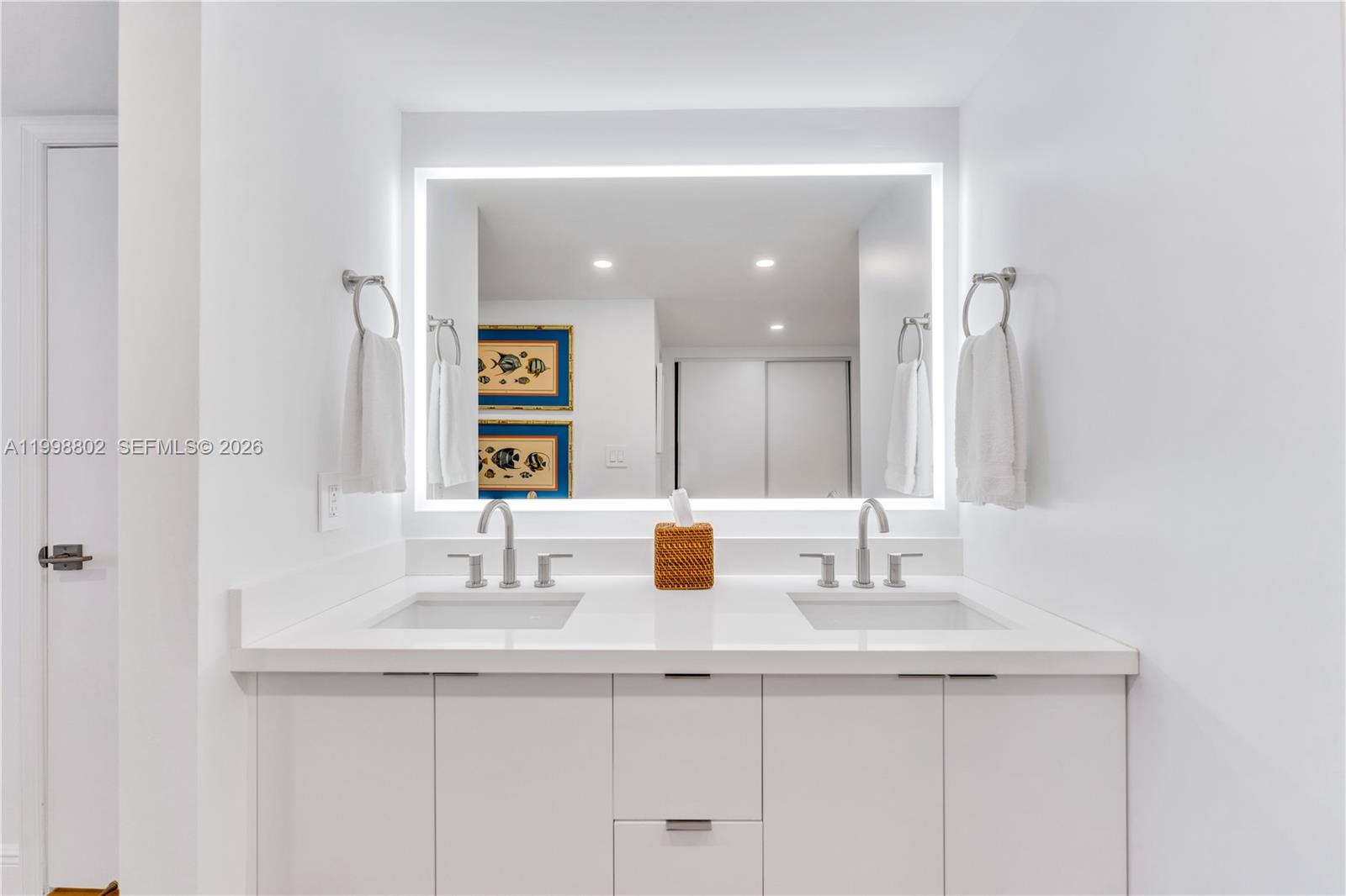 199 Ocean Ln Drive, Unit 306 Key Biscayne, FL 33149 - Photo 11 of 15 a bathroom with a sink and a mirror