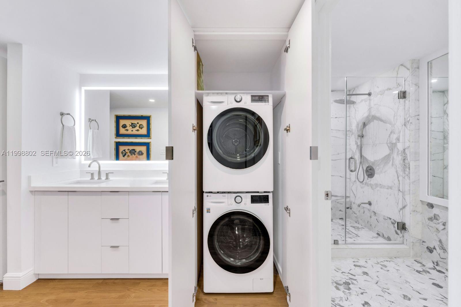 199 Ocean Ln Drive, Unit 306 Key Biscayne, FL 33149 - Photo 13 of 15 a utility room with sink dryer and washer