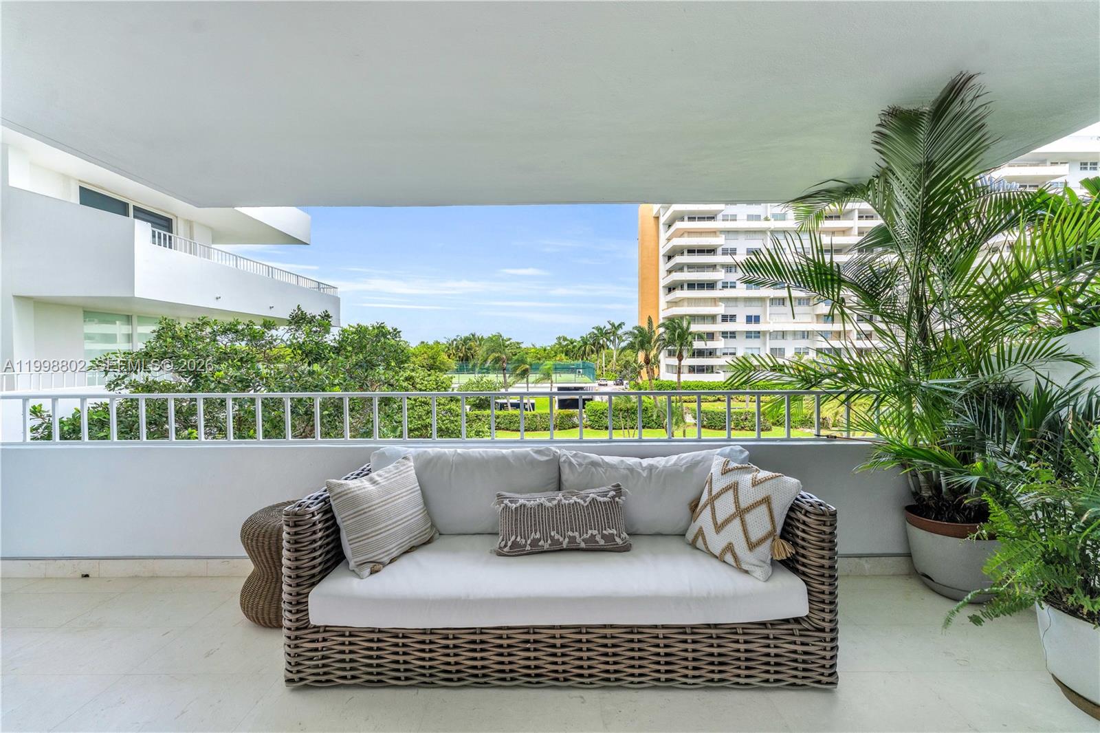 199 Ocean Ln Drive, Unit 306 Key Biscayne, FL 33149 - Photo 14 of 15 a balcony with furniture and a potted plant