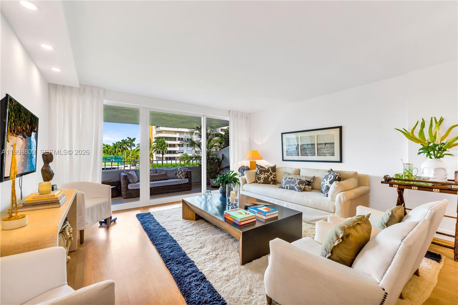 199 Ocean Ln Drive, Unit 306 Key Biscayne, FL 33149 - Photo 3 of 15 a living room with furniture and a large window