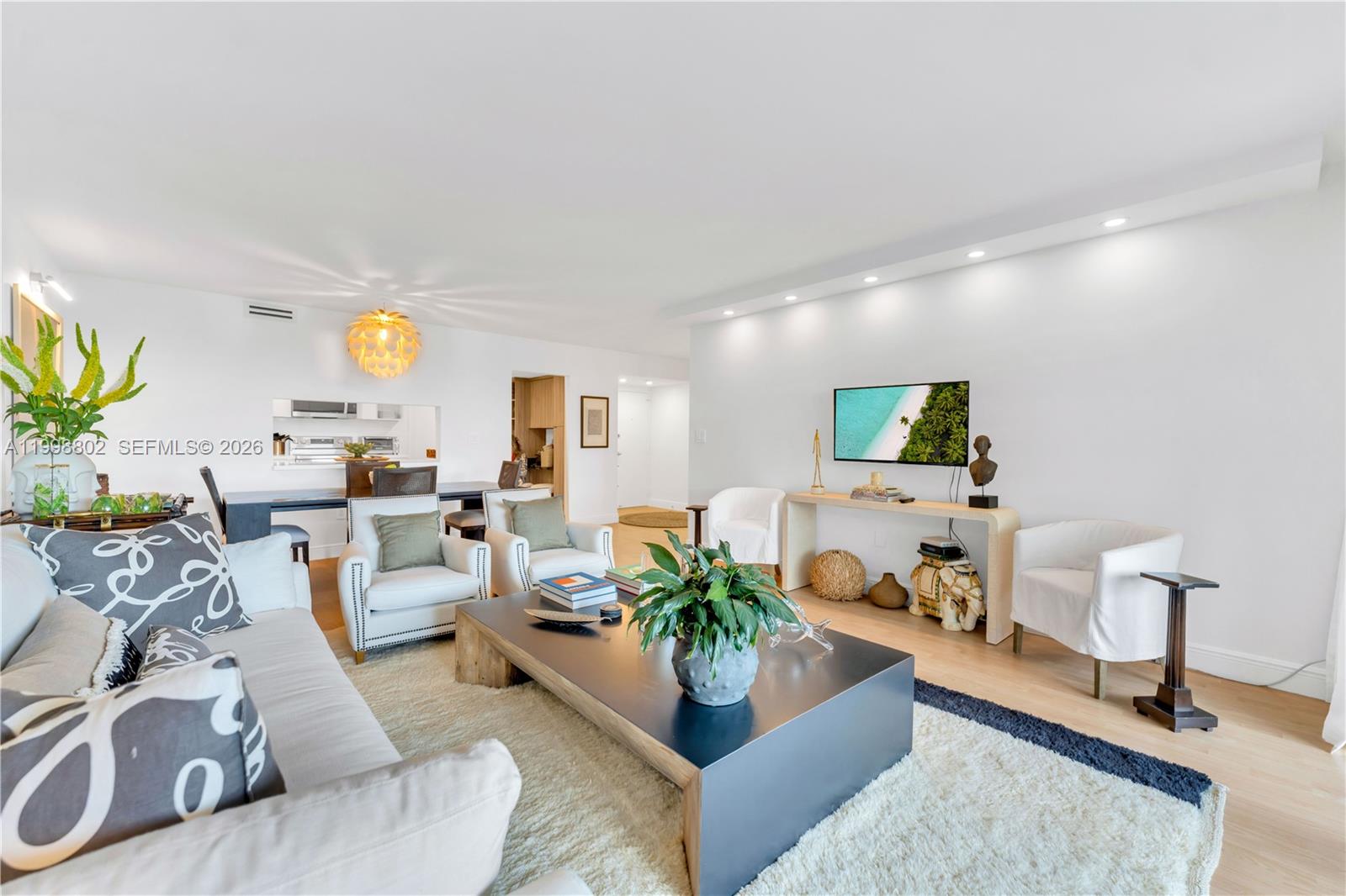 199 Ocean Ln Drive, Unit 306 Key Biscayne, FL 33149 - Photo 4 of 15 a living room with furniture and a lamp