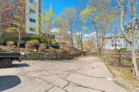 a view of a backyard with sitting area