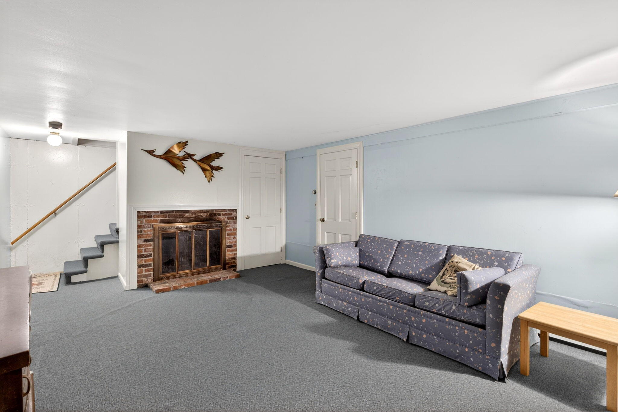 23 Nickerson Road Orleans, MA 02653 - Photo 24 of 54 a living room with furniture and a fireplace