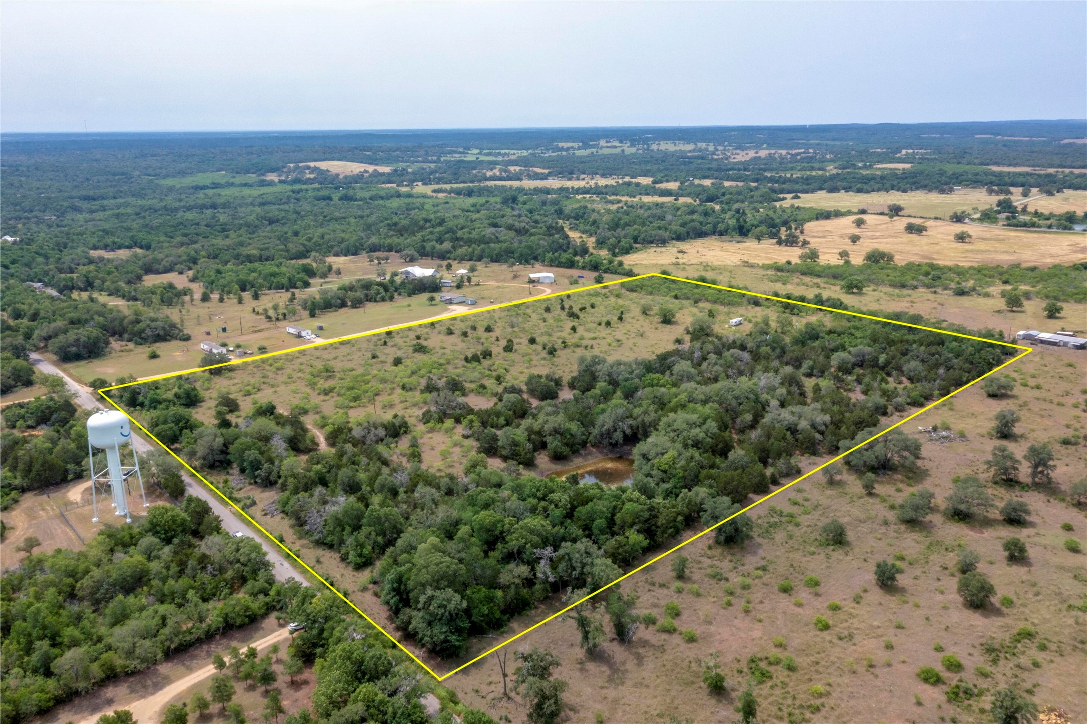 1931 Watterson Road Red Rock, TX 78662 - Photo 2 of 7 an aerial view of ocean and residential houses with outdoor space
