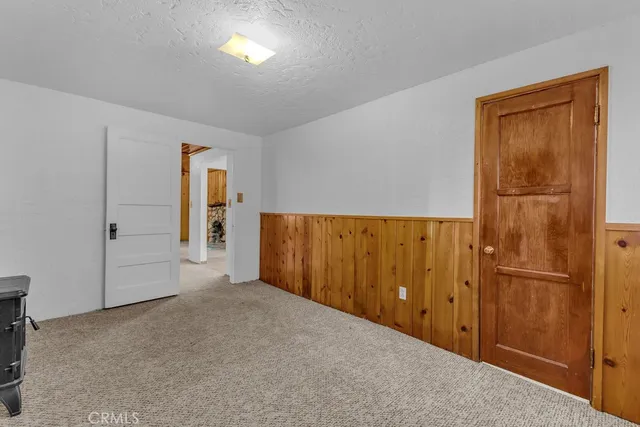 an empty room with closet area