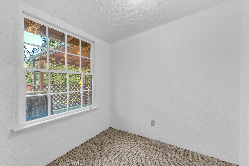 53705 Country Club Drive Idyllwild, CA 92549 - Photo 16 of 26 a view of an empty room with a window