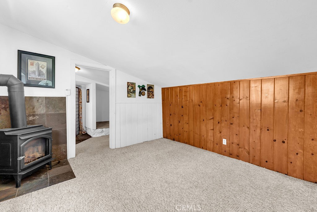 53705 Country Club Drive Idyllwild, CA 92549 - Photo 23 of 26 a view of an empty room with closet and a fireplace