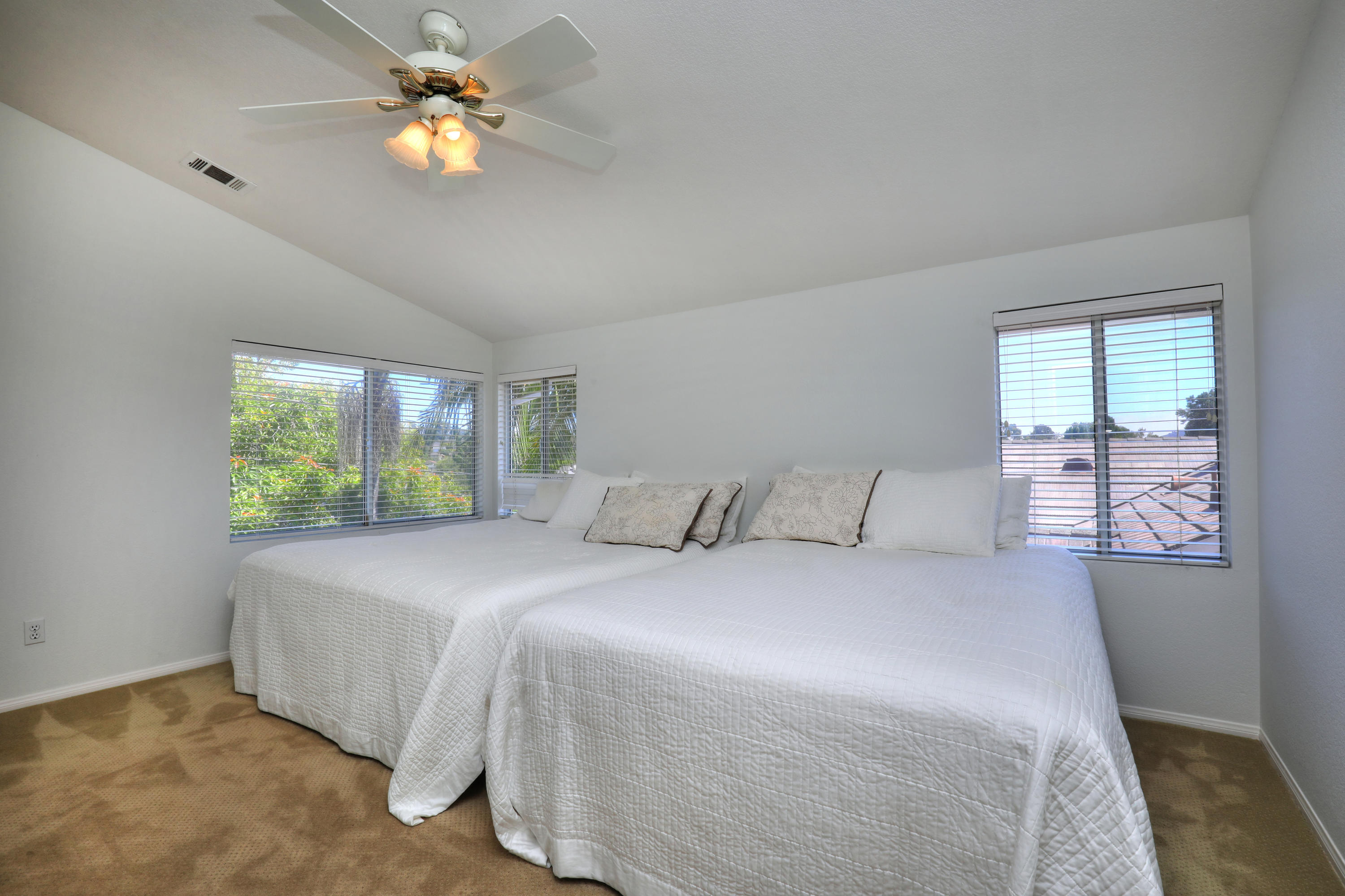 3713 Hitchcock Ranch Road Santa Barbara, CA 93105 - Photo 22 of 28 a bedroom with a bed chandelier and a window