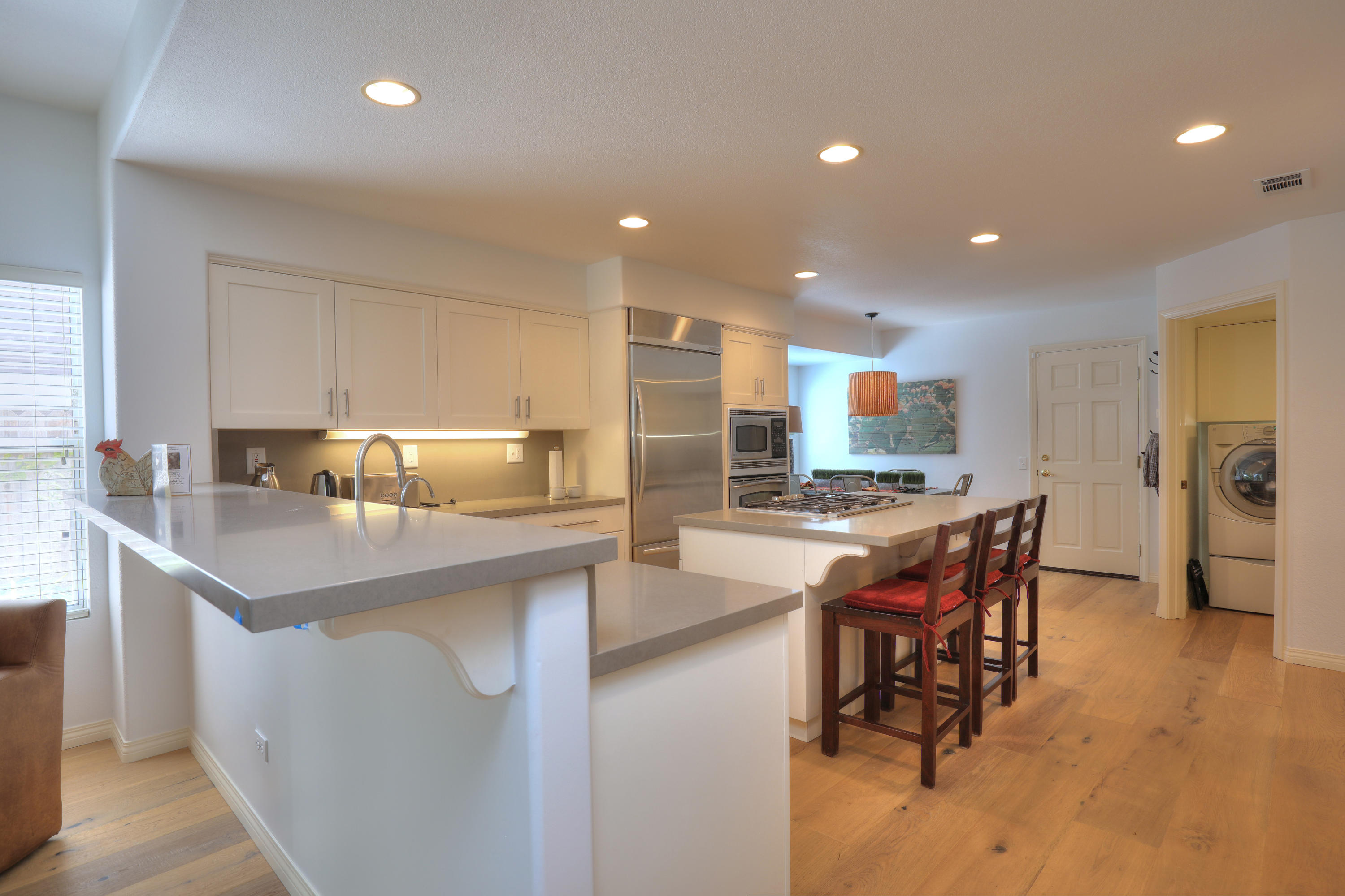 3713 Hitchcock Ranch Road Santa Barbara, CA 93105 - Photo 7 of 28 a kitchen with stainless steel appliances kitchen island granite countertop a sink and cabinets