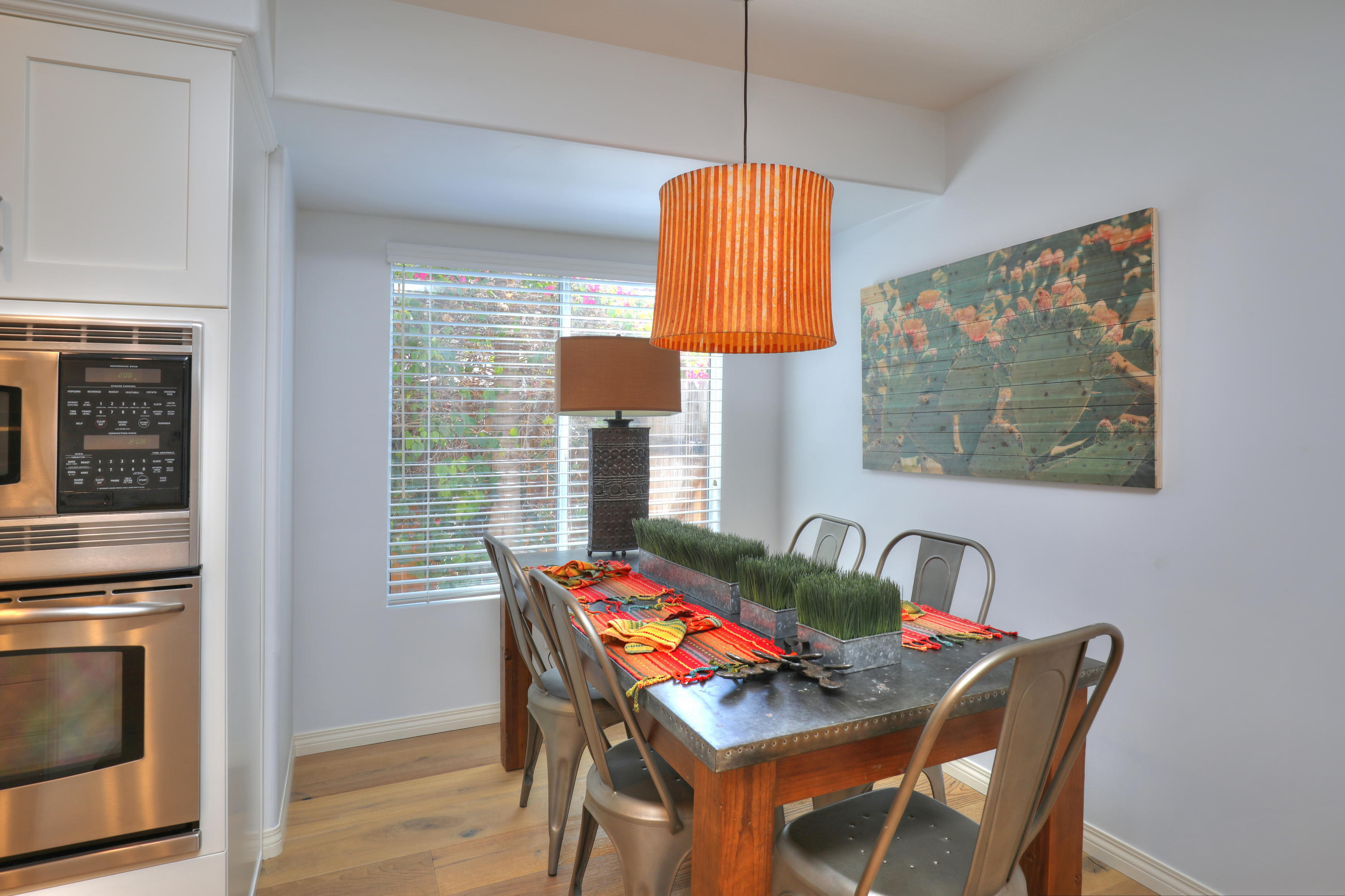 3713 Hitchcock Ranch Road Santa Barbara, CA 93105 - Photo 10 of 28 a dining room with furniture and a chandelier