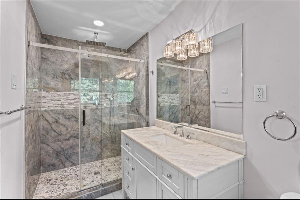 2150 Azalea Circle Decatur, GA 30033 - Photo 14 of 28 a bathroom with a granite countertop sink a mirror and a shower