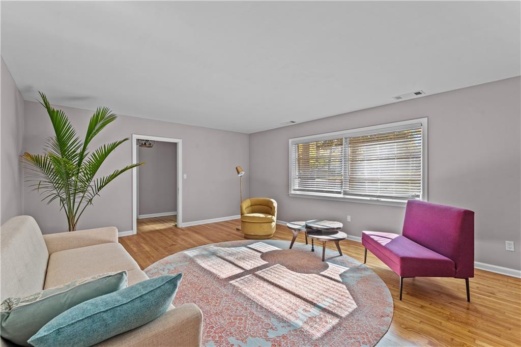 2150 Azalea Circle Decatur, GA 30033 - Photo 4 of 28 a bedroom with a bed a couch chair and a window