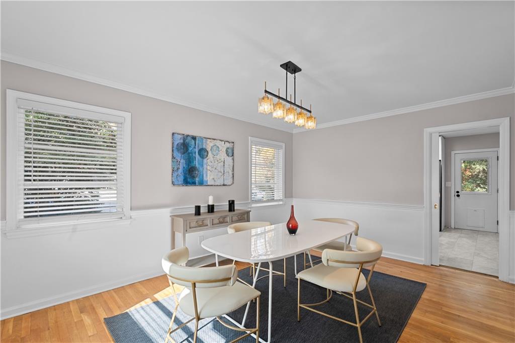 2150 Azalea Circle Decatur, GA 30033 - Photo 8 of 28 a view of a dining room with furniture and wooden floor