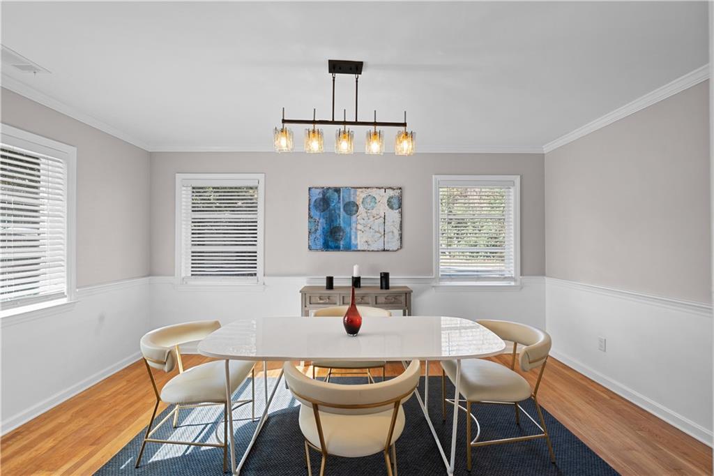 2150 Azalea Circle Decatur, GA 30033 - Photo 9 of 28 a dining room with furniture a chandelier and window