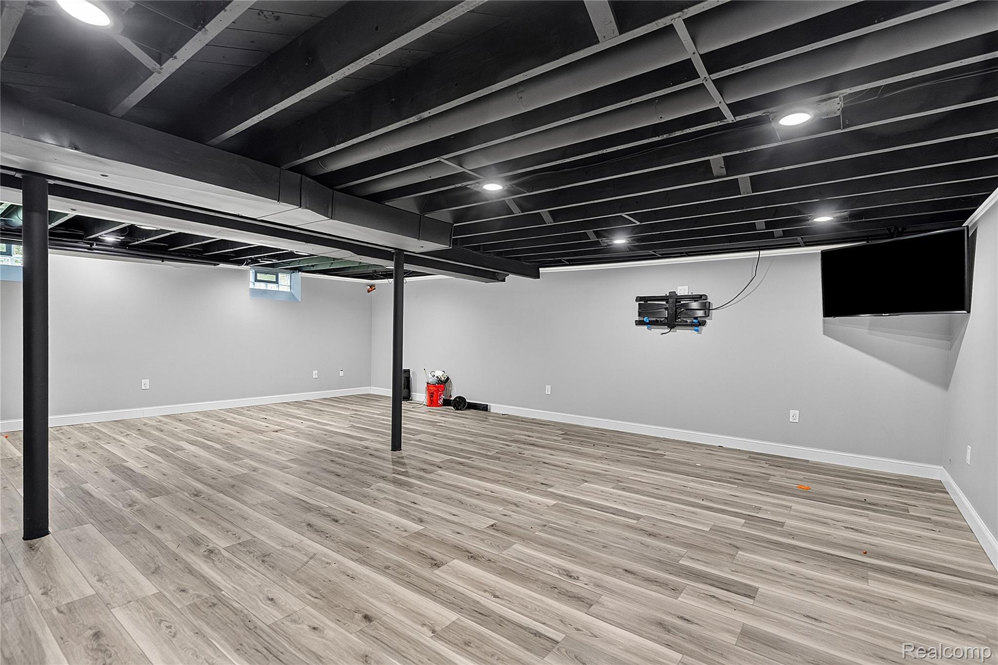 15879 Millar Road Clinton Township, MI 48036 - Photo 34 of 65 Finished room with wood-finish flooring, painted ceiling joists, recessed lighting, and light gray walls