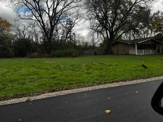 a view of a house with a street