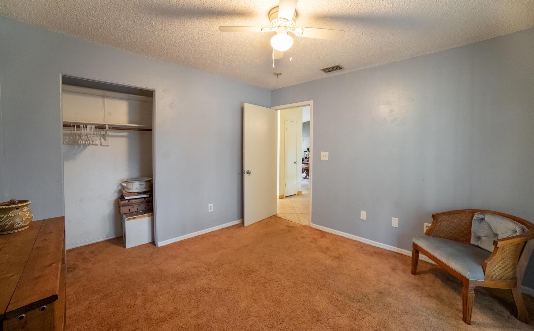 1533 West Powder Horn Road Titusville, FL 32796 - Photo 15 of 29 a bedroom with a bed and a chandelier