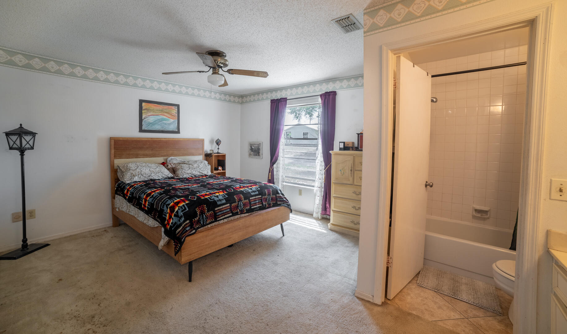 1533 West Powder Horn Road Titusville, FL 32796 - Photo 18 of 29 a bedroom with a bed and a table