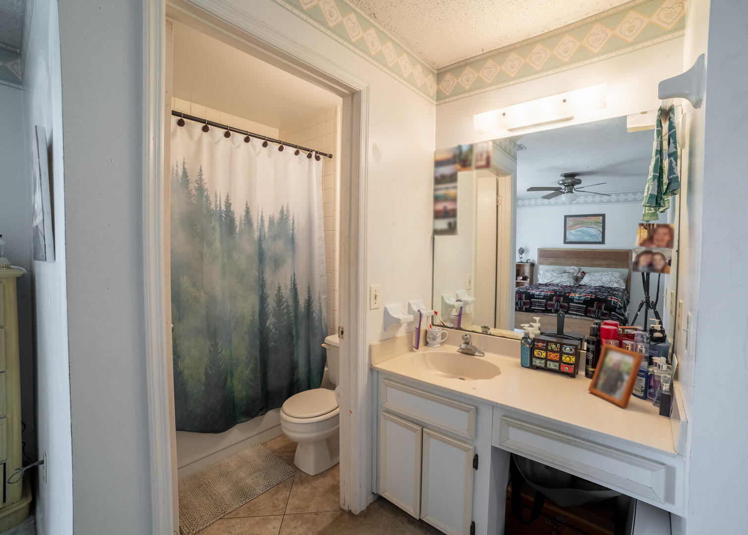 1533 West Powder Horn Road Titusville, FL 32796 - Photo 20 of 29 a bathroom with a double vanity sink toilet and shower