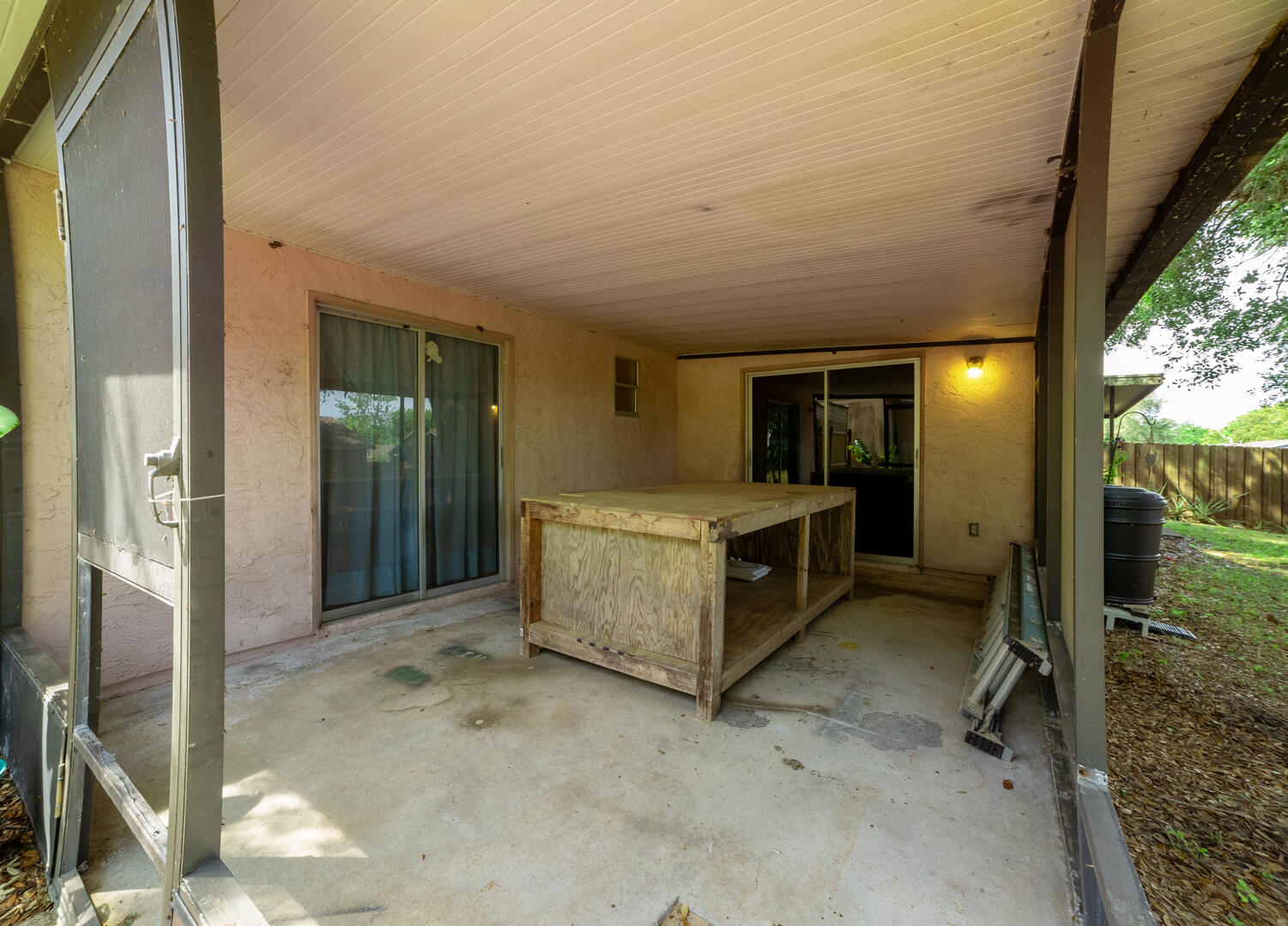 1533 West Powder Horn Road Titusville, FL 32796 - Photo 29 of 29 a view of a hallway with a sink and a refrigerator
