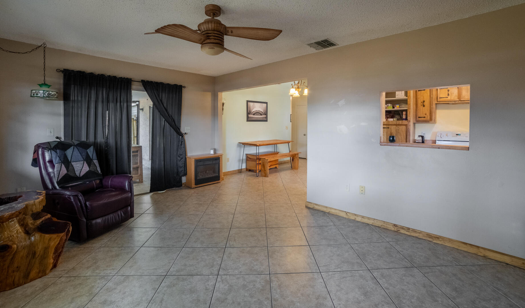1533 West Powder Horn Road Titusville, FL 32796 - Photo 7 of 29 a living room with furniture and a window