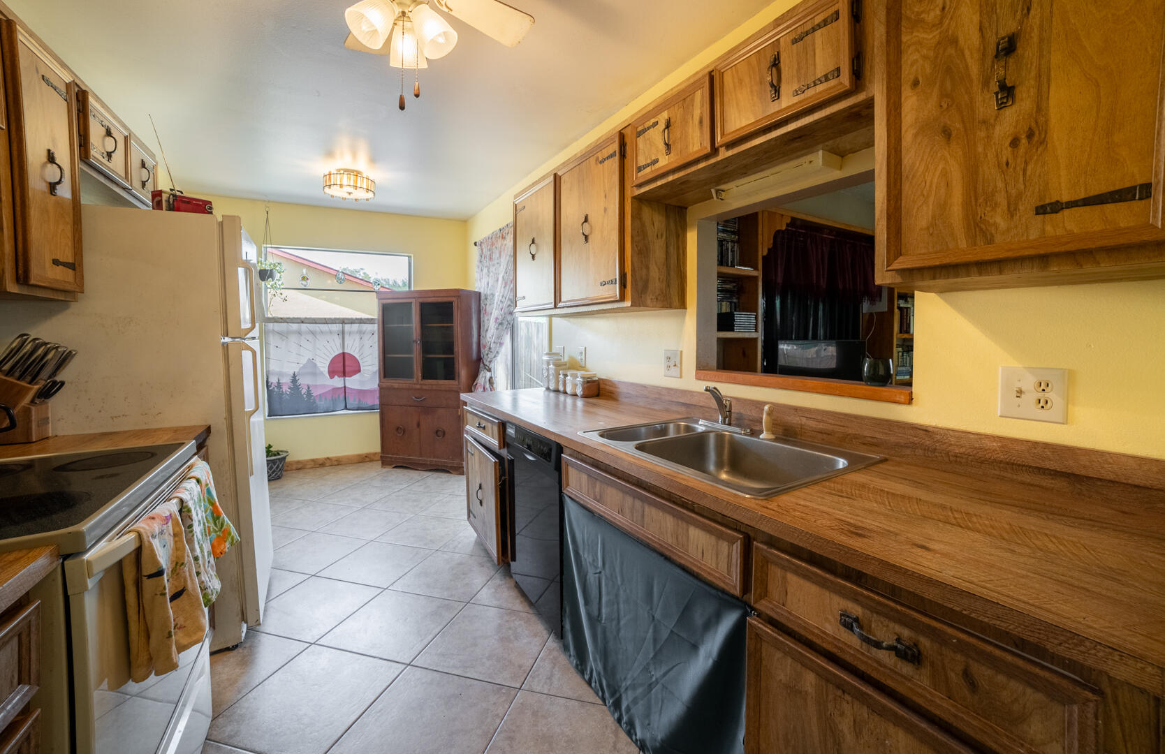 1533 West Powder Horn Road Titusville, FL 32796 - Photo 9 of 29 a kitchen that has a sink and a stove