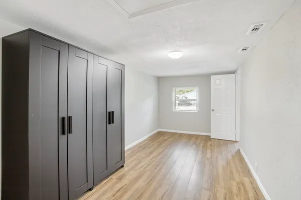 a view of entryway with wooden floor