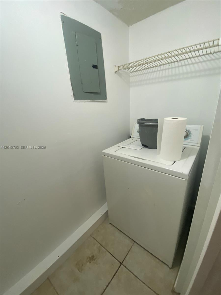 3410 Foxcroft Road, Unit 206 Miramar, FL 33025 - Photo 8 of 23 a utility room with dryer and washer