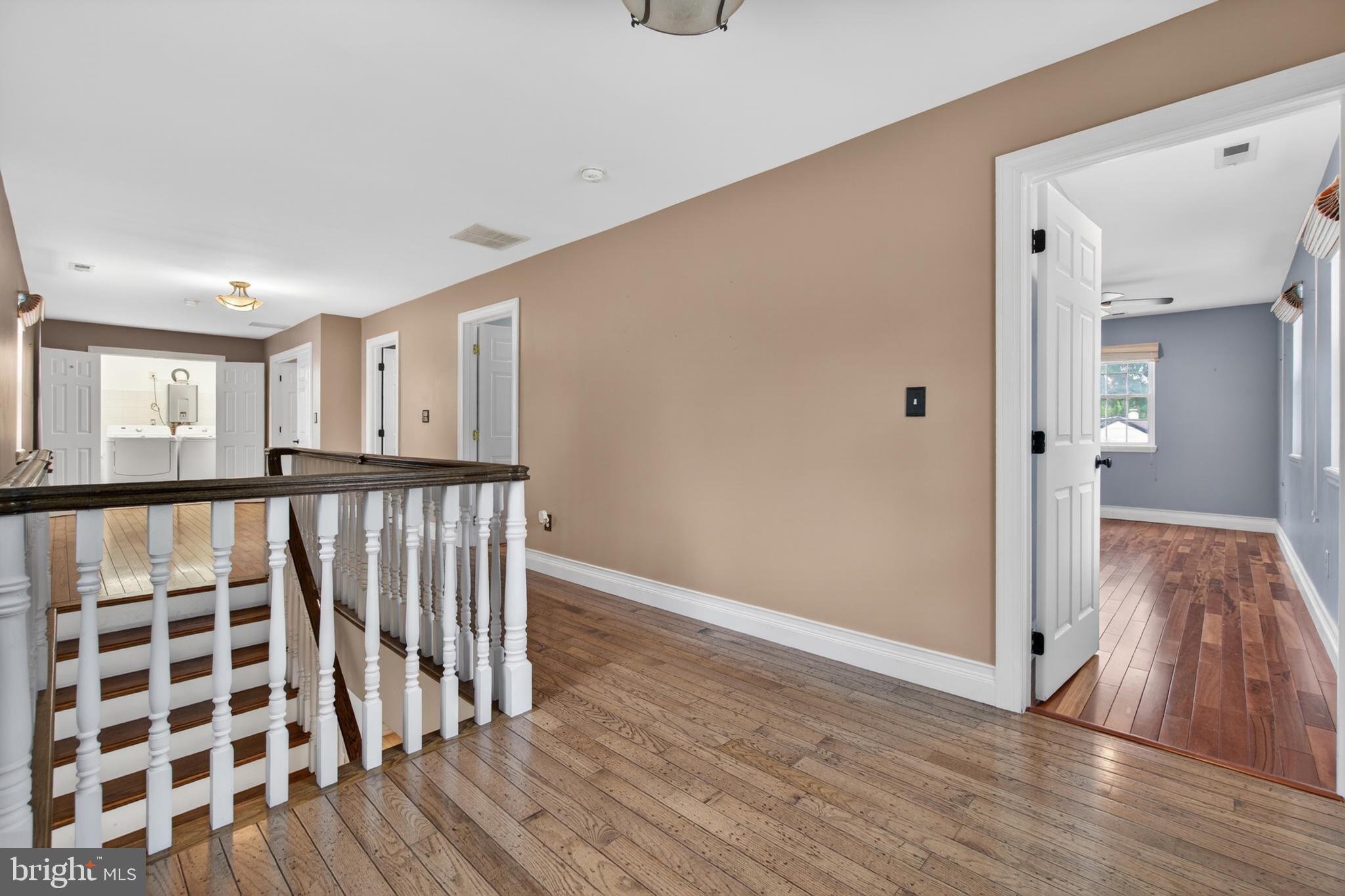 117 State Avenue Lindenwold, NJ 08021 - Photo 26 of 58 a view of a hallway with wooden floor and staircase