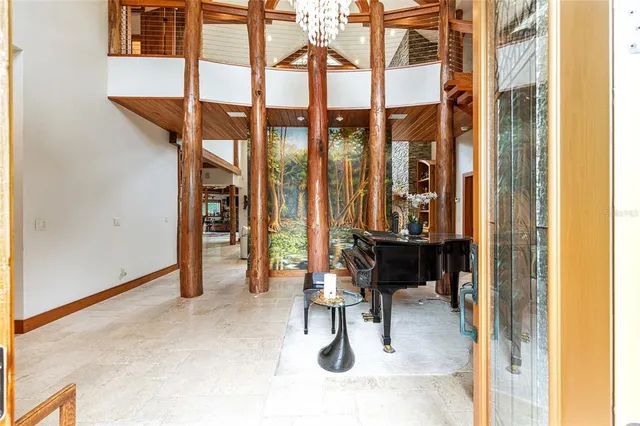 a view of a patio with table and chairs and potted plants