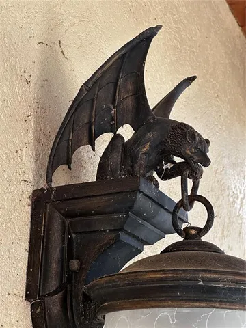 a view of a patio with dining table and chairs with a small yard