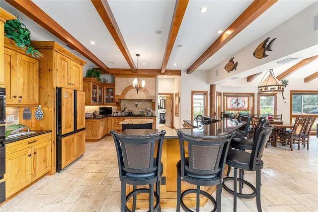 a en suite bathroom with a double vanity sink a mirror and a shower