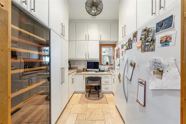 a bathroom with a window and a shower