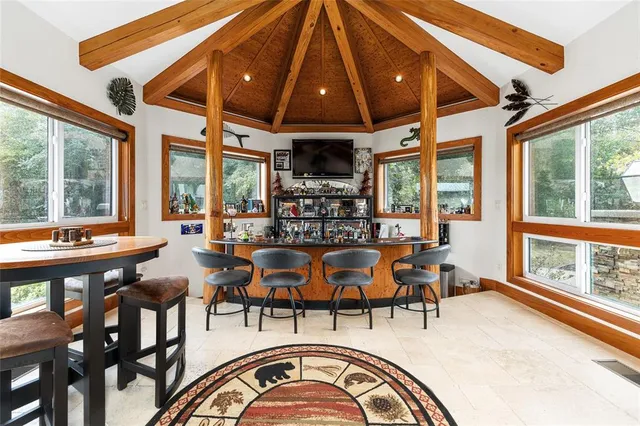 a bedroom with furniture and a window